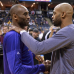 Kobe Bryant and Vince Carter embracing each other