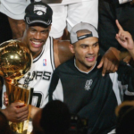 David Robinson celebrating a championship in 2003 with Tony Parker