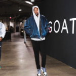 Kevin Durant walking in front of GOAT poster