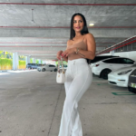 Katya Elise Henry posing in a car park