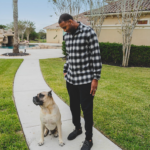 Tracy McGrady at home in Houston with his dog