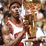 Michael Jordan lifting the NBA championship trophy