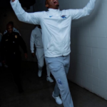 Penny Hardaway walking out of the tunnel as a coach of the Memphis Tigers