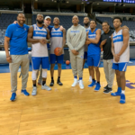 Penny Hardaway standing with players he coached including Raynere Thornton, Mike Parks Jr, and Kyvon Davenport