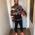 Walt Frazier with a basketball